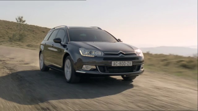 Video Reference: car, land vehicle, vehicle, family car, motor vehicle, mid size car, vehicle registration plate, automotive design, citroën, city car