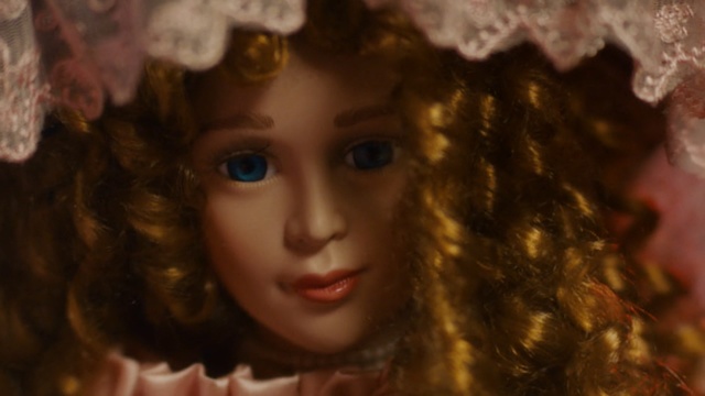 Video Reference: Face, Hair, Doll, Head, Lady, Beauty, Lip, Eye, Cheek, Ringlet, Person, Indoor, Clothing, Hat, Holding, Woman, Looking, Wearing, Girl, Young, Dress, Close, Front, Shirt, Sitting, Red, Glasses, Eyes, White, Standing, Man, Pizza, Bear, Umbrella, Stuffed, Human face, Headdress, Toy