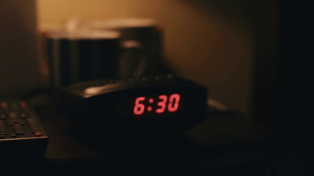 Video Reference: Alarm clock, Clock, Digital clock, Room, Photography, Home accessories, Electronic device, Display device, Interior design, Darkness