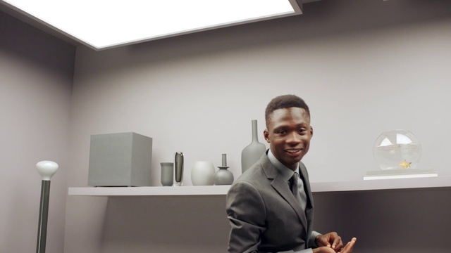 Video Reference: Room, Sitting, Interior design, White-collar worker, Photography, Desk, Furniture, Office, Suit