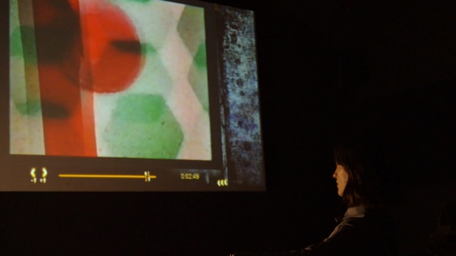 Video Reference: green, electronic device, art, darkness, modern art, display device, technology, multimedia, night, event