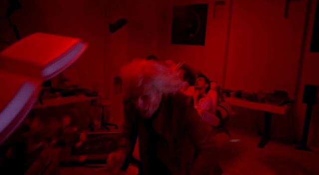 Video Reference: Red, Black, Room, Fun, Flesh, Mouth, Photography, Darkroom, Darkness, Performance, Indoor, Person, Man, Dark, Lit, Front, Light, Sitting, Woman, Table, Holding, Standing, Laptop, Computer, Young, Living, Playing, Dog, Kitchen, Bed, Night, Blurry, White, Wall, Concert, Band, Human face, Music