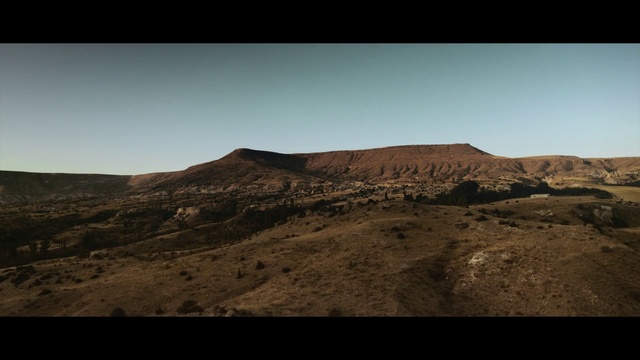 Video Reference: Mountainous landforms, Nature, Hill, Highland, Mountain, Sky, Wilderness, Badlands, Natural environment, Brown