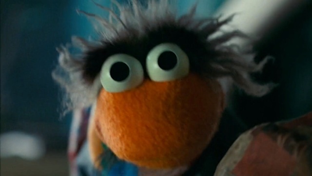 Video Reference: Stuffed toy, Toy, Plush, Orange, Organism, Textile, Eye, Close-up, Iris, Puppet