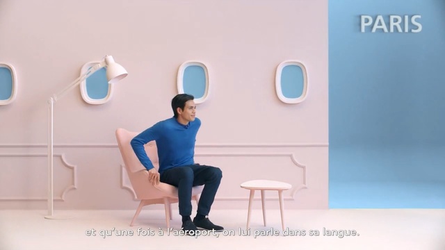 Video Reference: blue, sitting, furniture, table, shoulder, chair, girl, flooring, Person