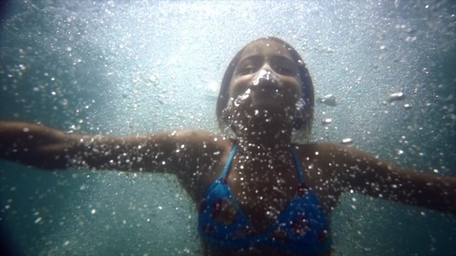 Video Reference: water, blue, underwater, fun, organism, sunlight, girl, reflection, rain, marine biology