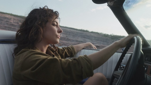 Video Reference: Water, Travel, Photography, Vehicle, Auto part, Driving, Long hair, Steering wheel, Vacation, Windshield