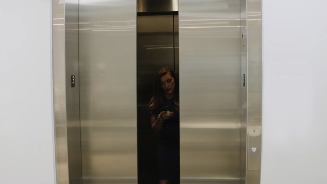 Video Reference: Elevator, Glass, Door, Room, Transparent material, Furniture, Metal, Indoor, Refrigerator, Cabinet, Mirror, Reflection, Looking, Open, Photo, Sitting, Standing, White, Shower, Man, Display, Water, Human face, Wall, Person, Woman, Clothing, Girl, Bathroom, Wardrobe, Opened