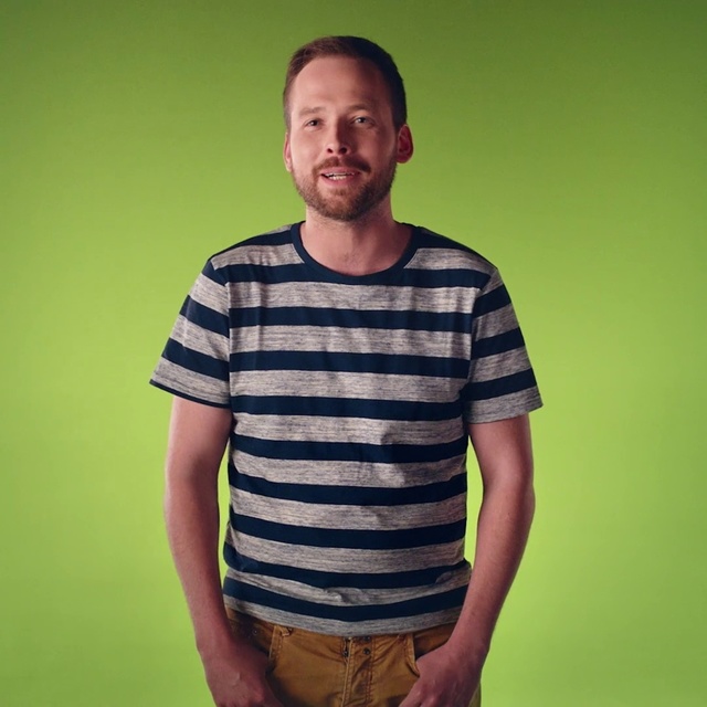 Video Reference: T-shirt, Green, Clothing, Cool, Yellow, Shoulder, Sleeve, Chin, Male, Neck, Person, Striped, Man, Standing, Shirt, Holding, Young, Front, Game, Woman, Table, Cake, White, People, Zebra, Human face, Smile