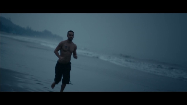 Video Reference: Ocean, Standing, Sea, Horizon, Atmospheric phenomenon, Wave, Recreation, Human, Sky, Wind wave, Person, Man, Outdoor, Water, Dark, Holding, Walking, Skiing, Snow, Cross, Riding, Cloudy, Covered, Hill, Flying, Woman, Dog, Air, Surfing, Board, Playing, Slope, Kite, Beach, Clothing, Swimming