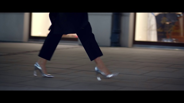 Video Reference: Human leg, Leg, Footwear, Standing, Shoe, Joint, Human body, Knee, Hand, Calf, Person, Indoor, Man, Holding, Game, Playing, Woman, Monitor, Room, Young, Video, Table, White, Ball, People, Blue, Clothing, Trousers, Dance, High heels