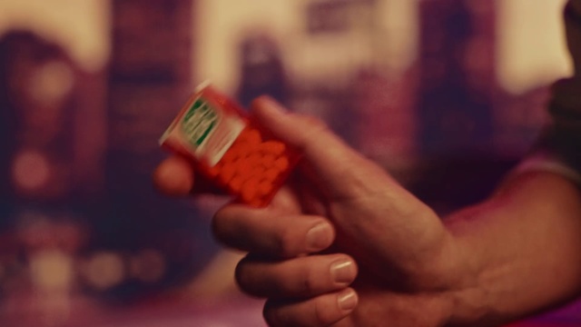Video Reference: Finger, Hand, Red, Thumb, Nail, Photography, Person, Indoor, Holding, Sitting, Remote, Control, Food, Table, Man, Close, Phone, Text, Snack