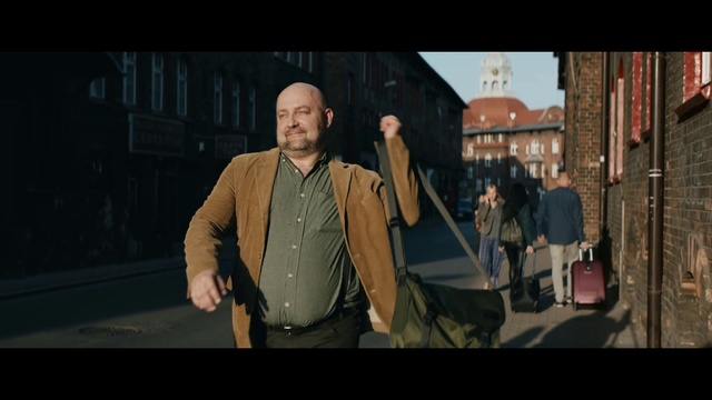 Video Reference: Snapshot, Human, Screenshot, Photography, Gentleman, Pc game, Fun, Digital compositing, Action film, Movie, Person, Man, Woman, Standing, People, Couple, Suitcase, Holding, Table, Cake, Luggage, Walking, Cutting, Street, Board, Group, Train, Wedding, Clothing, Human face, Text, Jacket, Video game