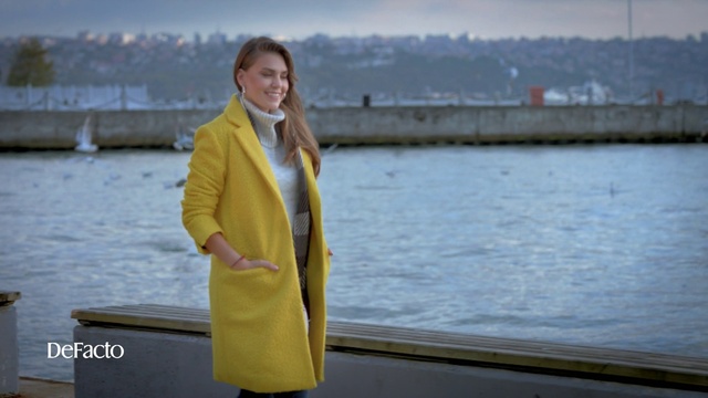 Video Reference: Yellow, Outerwear, Raincoat, Overcoat, Coat, Jacket, Photography, Suit, Travel, Trench coat