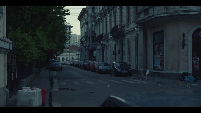 Video Reference: car, urban area, street, town, road, mode of transport, infrastructure, sky, screenshot, neighbourhood