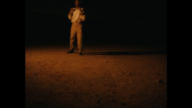 Video Reference: Black, Darkness, Light, Brown, Lighting, Performance art, Standing, Human, Night, Shadow