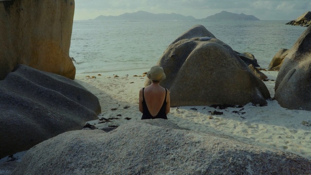 Video Reference: rock, sea, boulder, coastal and oceanic landforms, vacation, coast, ocean, sky, formation, water, Person