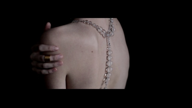 Video Reference: jewellery, necklace, fashion accessory, chain, arm, fashion, chest, neck, abdomen, back, Person