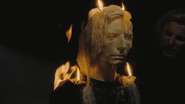 Video Reference: Sculpture, Head, Lighting, Art, Forehead, Statue, Temple, Portrait, Darkness, Carving, Nature, Person, Fire, Dark, Looking, Building, Front, Lit, Cake, Holding, Standing, Man, Woman, Wearing, Fireplace, Sitting, Table, Red, Yellow, White, Phone, Night, Street, Human face