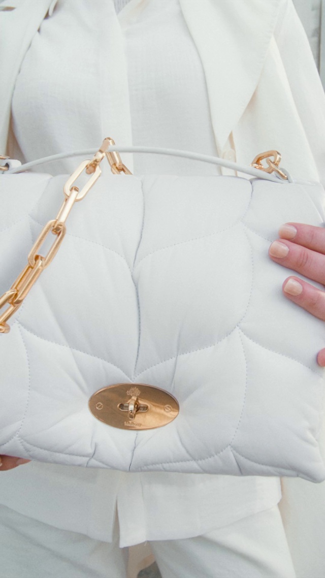 Video Reference: Hand, Dress shirt, Neck, Sleeve, Beige, Orange, Collar, Material property, Comfort, Blazer