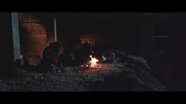 Video Reference: campfire, darkness, fire, night, screenshot, geological phenomenon, flame, atmosphere, bonfire, heat, Person