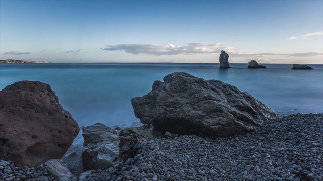 Video Reference: sea, coast, sky, shore, rock, coastal and oceanic landforms, horizon, promontory, ocean, water, Person