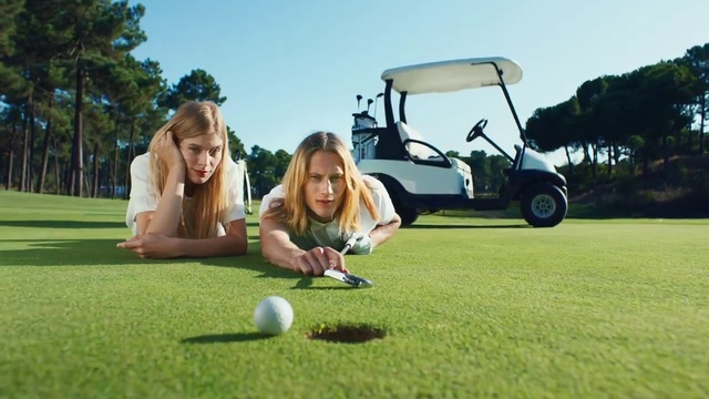 Video Reference: Golfer, Golf cart, Golf course, Golf, Sport venue, Grass, Professional golfer, Leisure, Golf equipment, Golf club