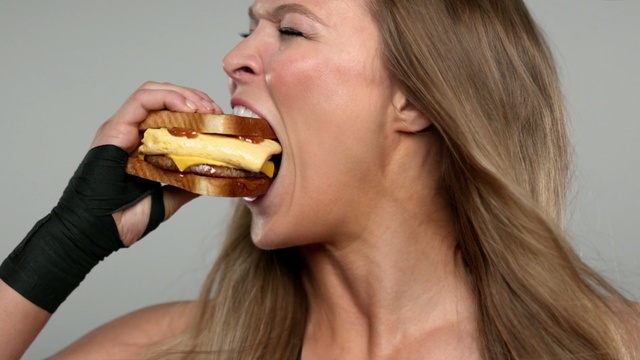 Video Reference: junk food, eating, mouth, brown hair, neck, food