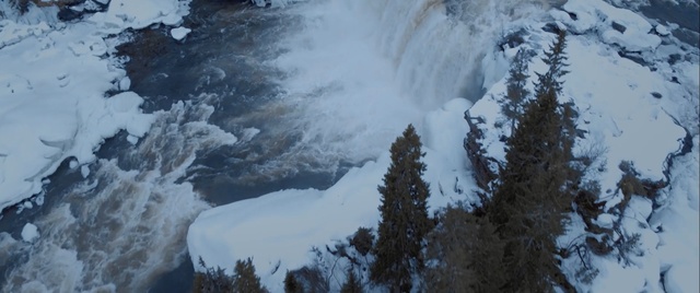 Video Reference: winter, freezing, snow, geological phenomenon, mountain, waterfall, terrain, sky, ice, water feature, Person