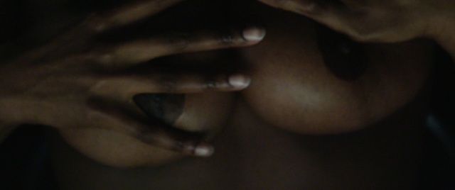 Video Reference: face, black, nose, lip, finger, chin, hand, eyebrow, darkness, cheek