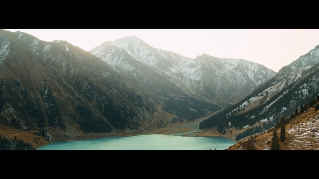 Video Reference: mountainous landforms, nature, mountain, wilderness, lake, mountain range, sky, water, highland, reflection