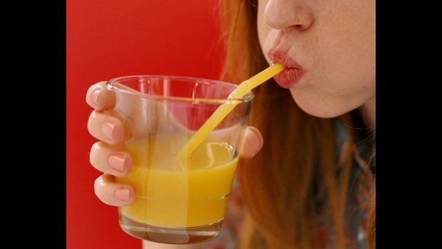 Video Reference: Drink, Juice, Drinking, Orange drink, Lip, Food, Orange juice, Drinking straw, Smoothie, Non-alcoholic beverage