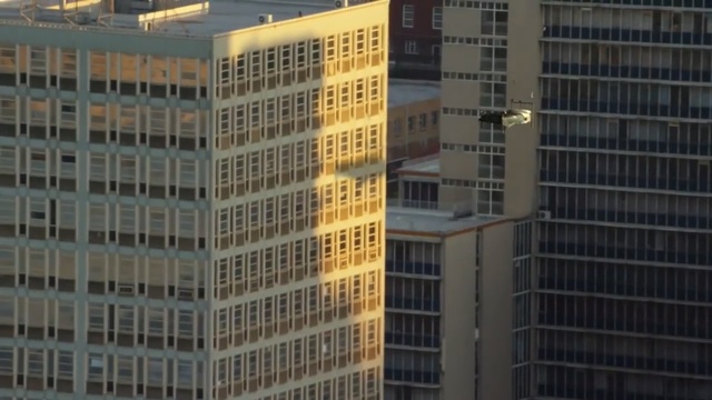 Video Reference: Metropolitan area, Building, Tower block, Urban area, Metropolis, Skyscraper, City, Condominium, Daytime, Commercial building