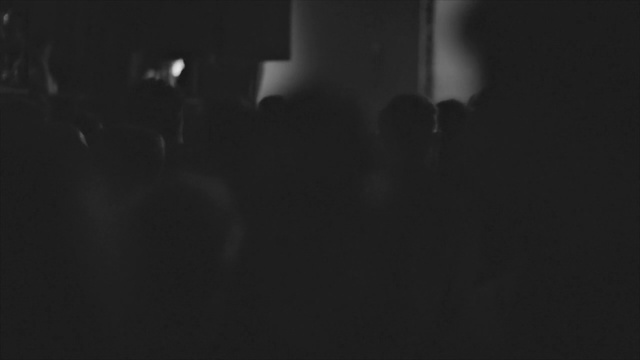 Video Reference: Black, White, Darkness, Photograph, Light, Monochrome, Black-and-white, Monochrome photography, Snapshot, Night, Dark, Sitting, Laptop, Close, Man, Cat, Computer, Room, Standing, Sign, Black and white, Concert