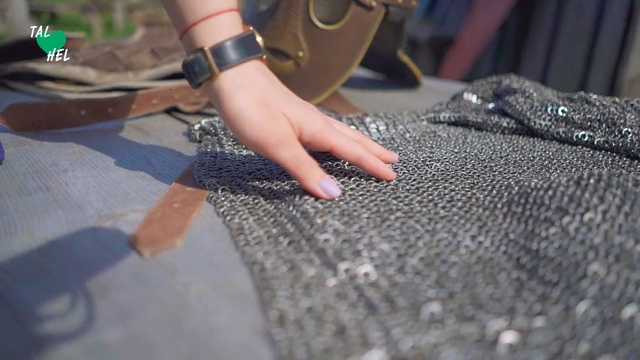 Video Reference: Hand, Nail, Finger, Material property, Textile, Floor, Flooring, Shoe, Person, Indoor, Sitting, Table, Small, Holding, Using, Black, Computer, Green, Desk, Man, White, Room, City, Motorcycle, Plate, Playing, Watch, Fashion accessory, Feet, Footwear