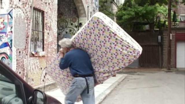 Video Reference: mode of transport, public space, urban area, neighbourhood, textile, street, recreation, window, pattern, product, Person