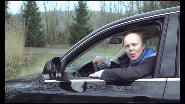 Video Reference: car, motor vehicle, vehicle, vehicle door, family car, mode of transport, automotive design, driving, windshield, automotive exterior, Person