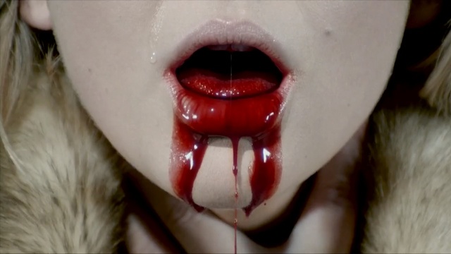 Video Reference: tongue, lip, tooth, mouth, close up, jaw, snout, fang, organ, blood