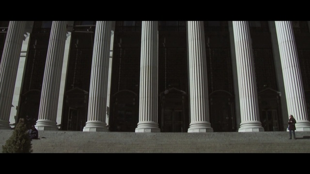 Video Reference: column, landmark, structure, architecture, light, metropolis, symmetry, darkness, facade, sky, Person