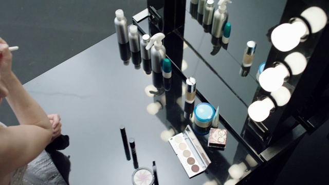 Video Reference: Hand, Electronic instrument, Games, Person, Woman, Table, Holding, Mirror, Playing, Video, Game, Young, Teeth, Remote, Brushing, Black, White, Man, Dog, Wii, Plate, Swinging, Bottle, Office supplies, Medical equipment, Lego