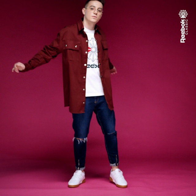 Video Reference: Clothing, Outerwear, Coat, Standing, Fashion, Sleeve, Footwear, Action figure, Jacket, Textile, Person