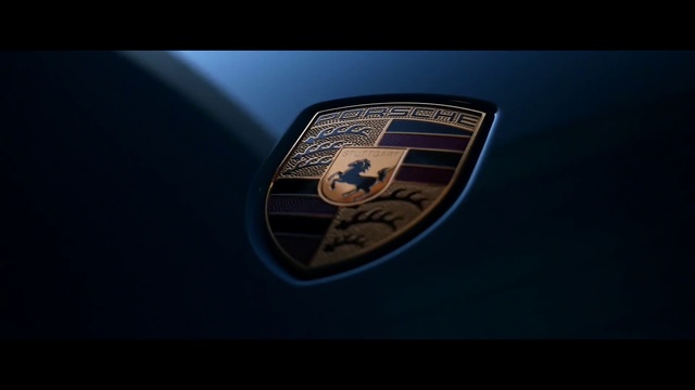 Video Reference: Automotive design, Emblem, Vehicle, Car, Logo, Trademark, Font, Symbol, Porsche, Macro photography