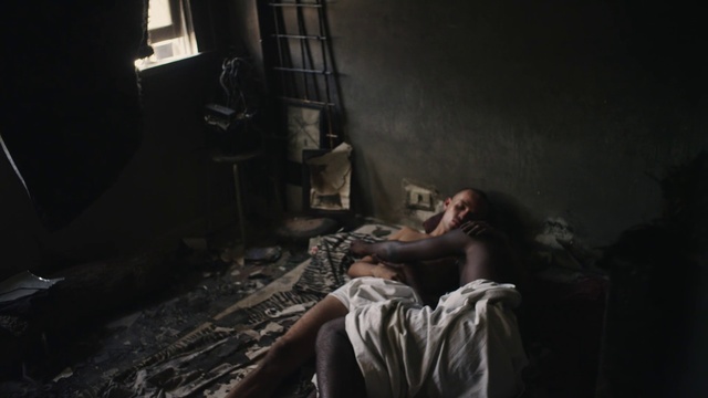 Video Reference: Black, Darkness, Photography, Human, Room, Leg, Human body, Hand, Fiction, Sitting