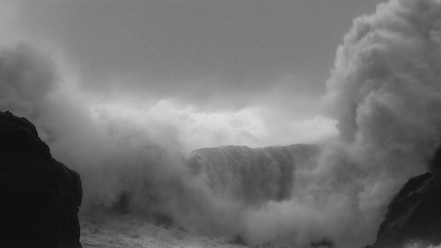 Video Reference: Wave, Sky, Geological phenomenon, Atmospheric phenomenon, Cloud, Wind wave, Sea, Black-and-white, Rock, Storm