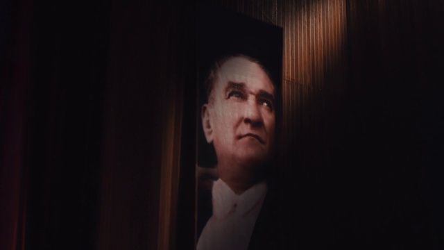 Video Reference: Face, Black, Portrait, Photograph, Darkness, Head, Facial hair, Chin, Cheek, Nose