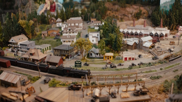 Video Reference: transport, scale model, city, vehicle, track, suburb, aerial photography, bird eye view, village