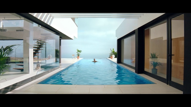 Video Reference: Water, Building, Swimming pool, Cloud, Azure, Rectangle, Window, Shade, Condominium, Interior design