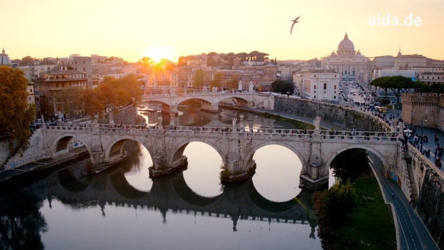 Video Reference: Arch bridge, Bridge, Reflection, River, Landmark, Sky, Morning, Town, Water, Architecture, Person