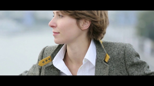 Video Reference: Hair, Facial expression, Nose, Hairstyle, Chin, Skin, Beauty, Outerwear, Street fashion, Neck