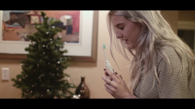 Video Reference: hair, human hair color, blond, girl, event, finger, hand, tree, christmas, decor, Person